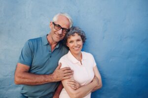 Smiling mature couple standing together